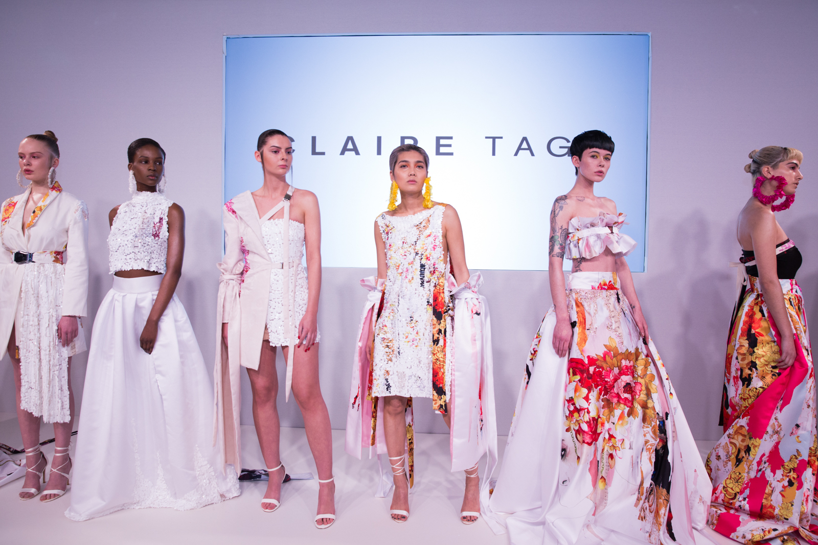 Group shot of 5 outfits at the Claire Tagg FW18 presentation at London Fashion Week