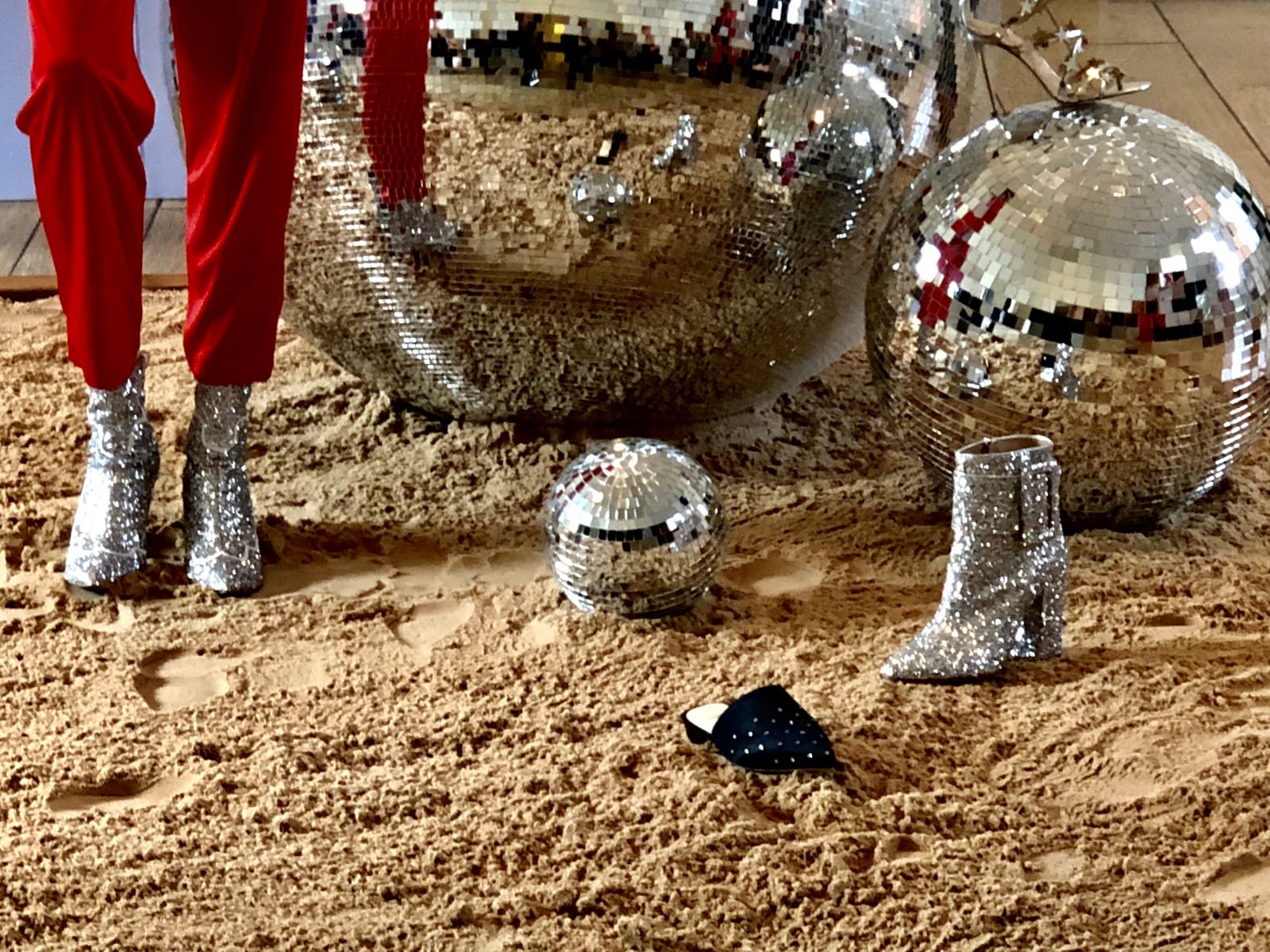 Alexander White FW18 London Fashion Week Lead Image of a disco ball and glittery cowboy boots
