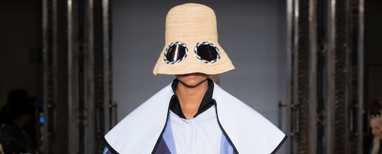 Simon Mo SS19 LFW Fashion Voyeur Blog Close up of a model wearing a hat with a low brim fitted with lenses